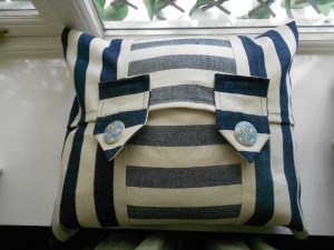 Cream And Blue Cushion With Two Tabs and Pale Blue Buttons