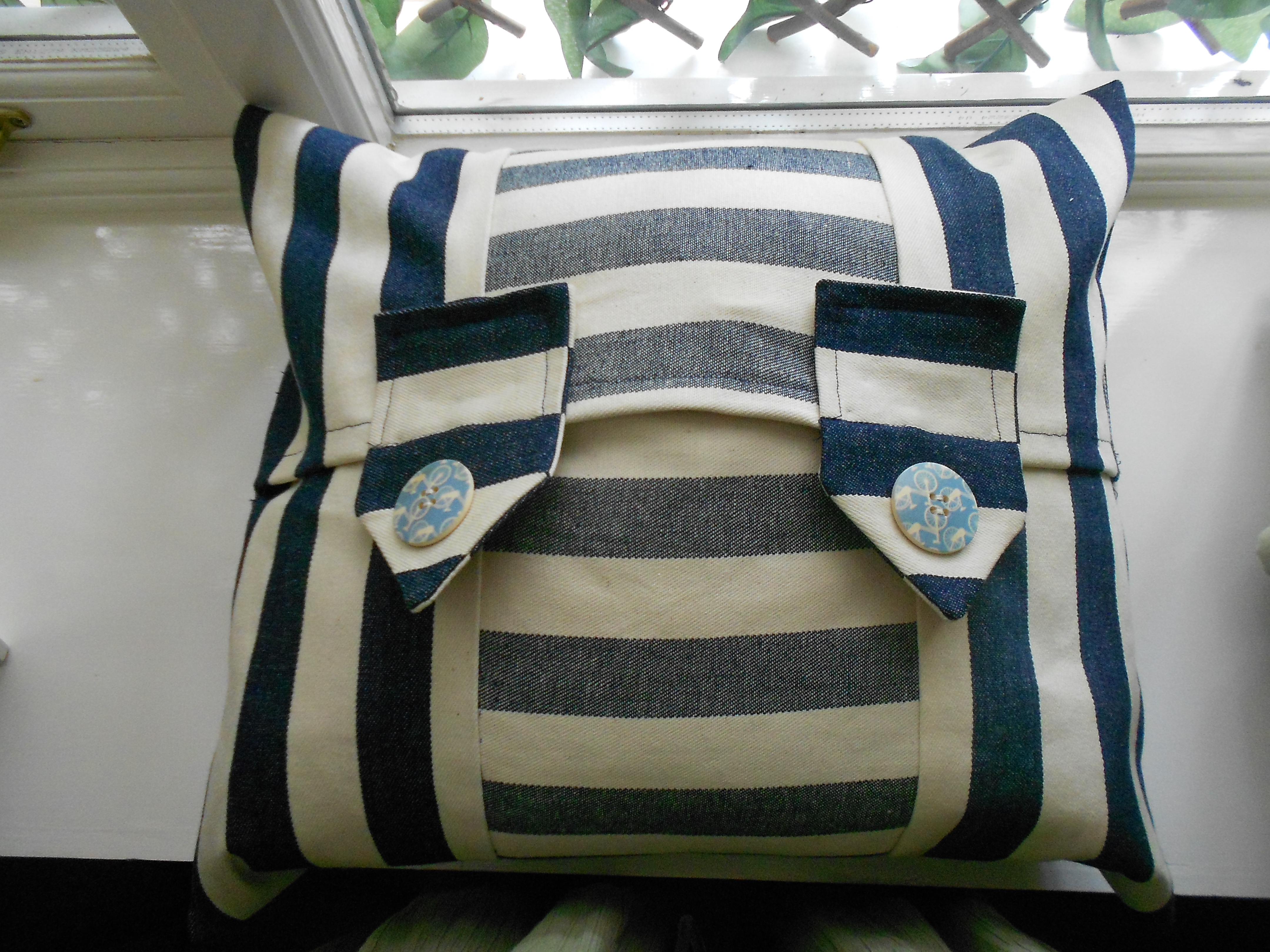Cream And Blue Cushion With Two Tabs and Pale Blue Buttons