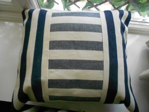 Blue and Cream Stripped Cushion With Plain Back View